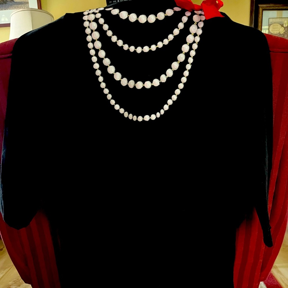 Black holiday dress. With Red bow and fake painted Pearl necklace.